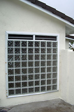 Large glass block window with vents.